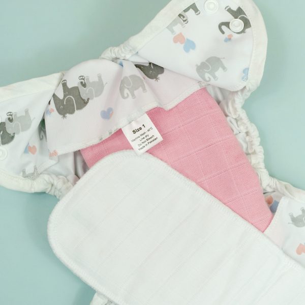Muslin as a nappy pad fold with booster